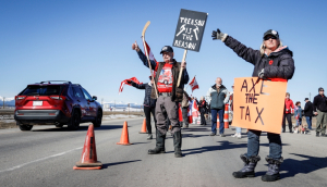 ‘It just needs to stop’: Carbon price protesters slow traffic on Trans-Canada Highway