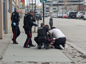 Someone jumps off the top floor of a parkade downtown. Drops 5 Storeys to the Ground.