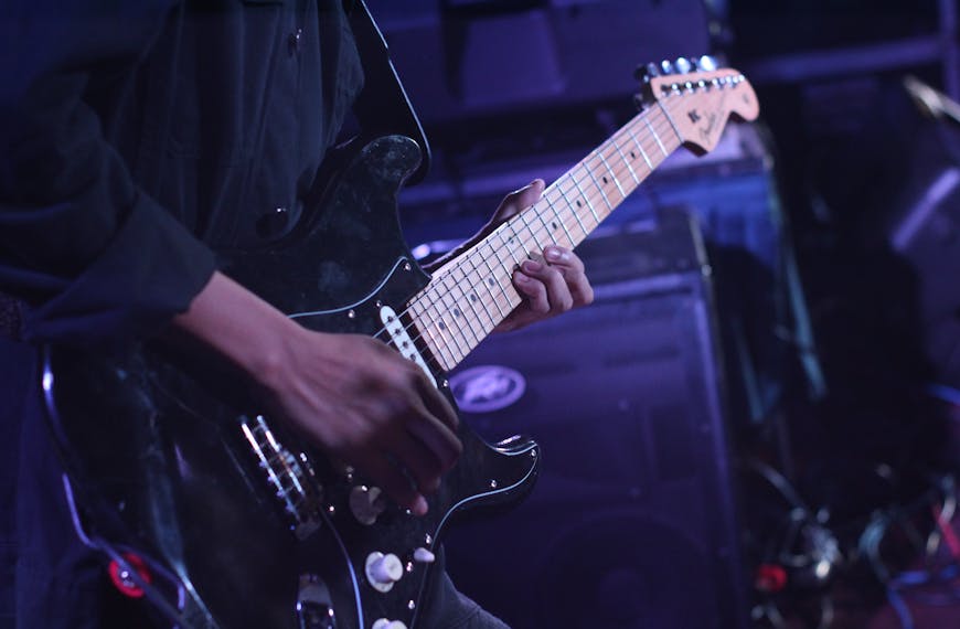 Person Using Black Fender Stratocaster