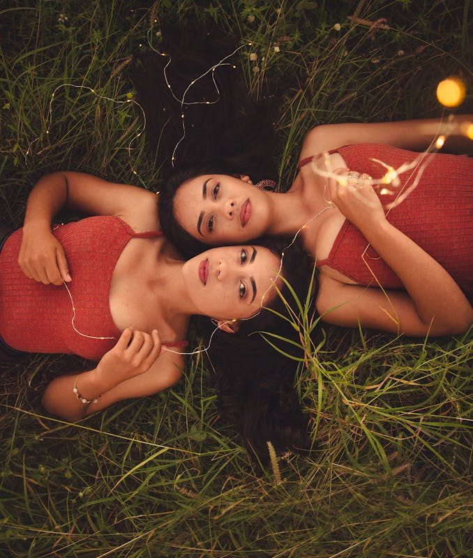 Two Women Lying on Grass