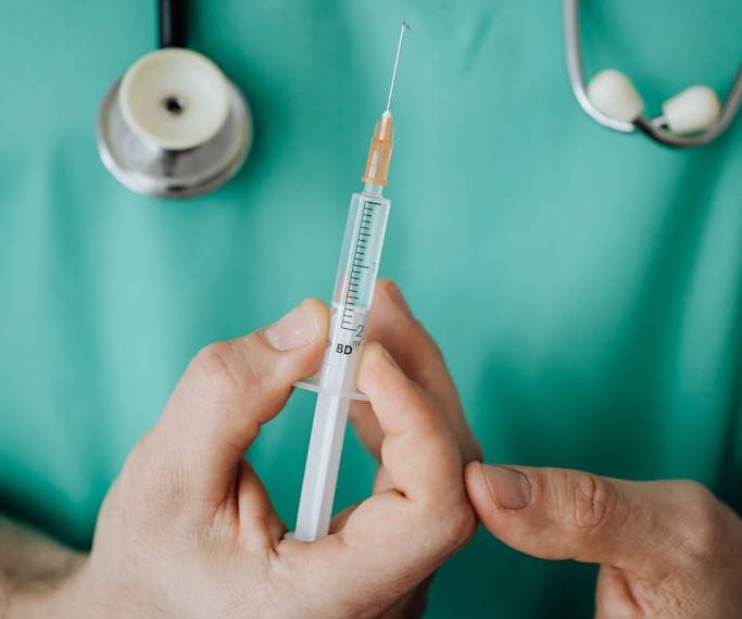 Person Holding A Vaccine