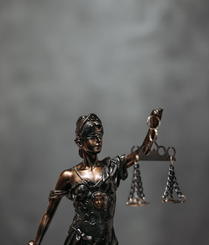 Close-Up Shot of a Statuette of Lady Justice